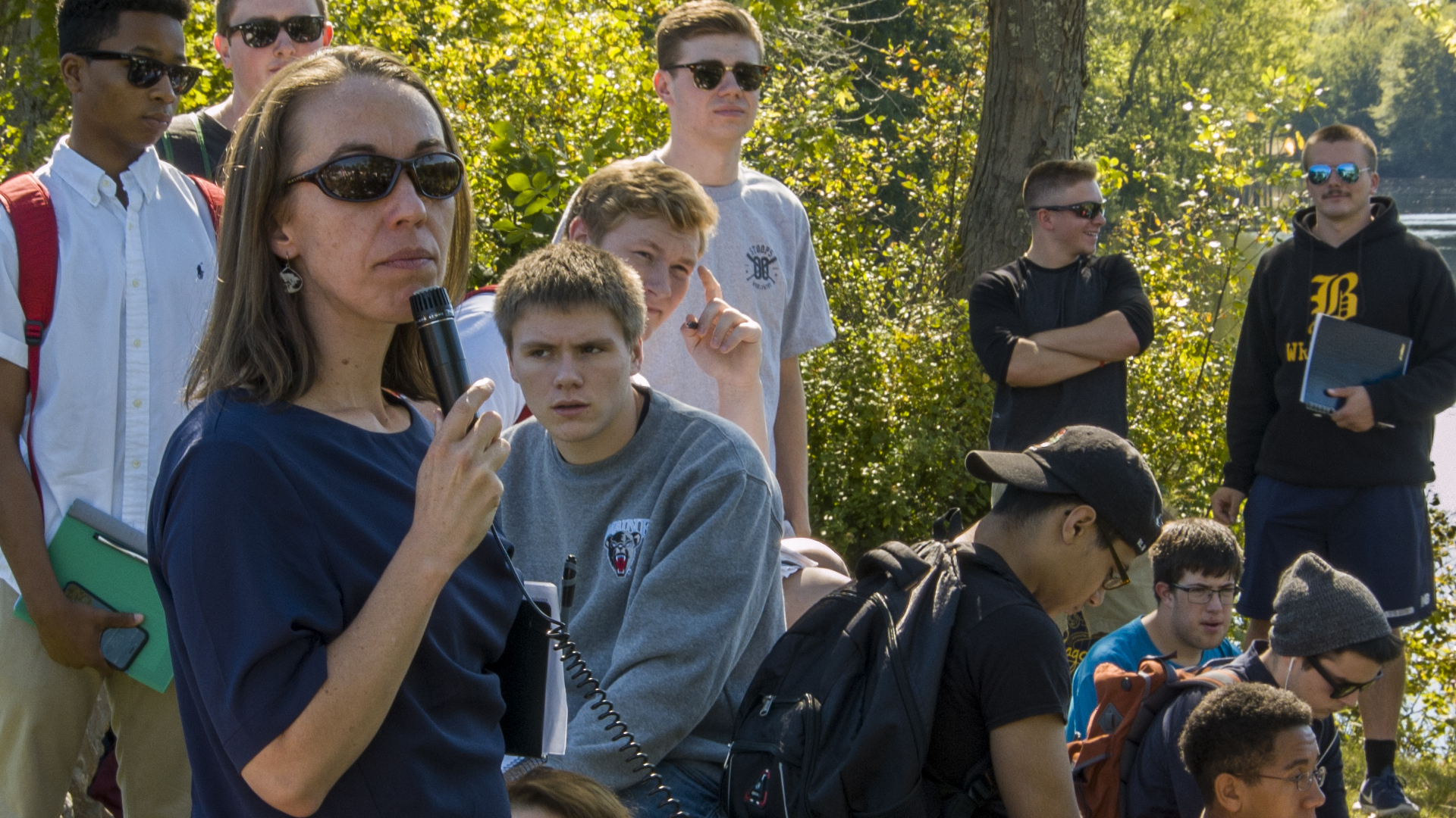 Dr. Bridie McGreavy with students by the Stillwater river